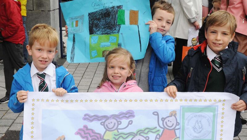 Among those taking part in a show of support outside City Hall, prior to a meeting of Cork City Council, for Gaelscoil an Ghoirt Álainn, Mayfield, Cork, by parents, pupils, family members and staff of the school in relation to the construction of the new school building were (front from left) Fiachra and Sadbh Ó Dubhlainn and Cuan Singleton and (at back) Shane Ó Murchú. Picture: Denis Minihane. Among those taking part in a show of support outside City Hall, prior to a meeting of Cork City Council, for Gaelscoil an Ghoirt Álainn, Mayfield, Cork, by parents, pupils, family members and staff of the school in relation to the construction of the new school building were (front from left) Fiachra and Sadbh Ó Dubhlainn and Cuan Singleton and (at back) Shane Ó Murchú. Picture: Denis Minihane.
