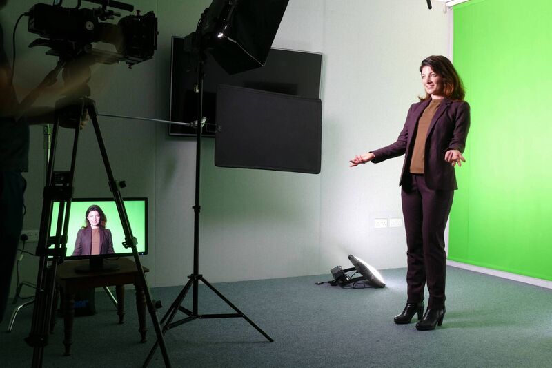 Services offered include a green screen in the studio.