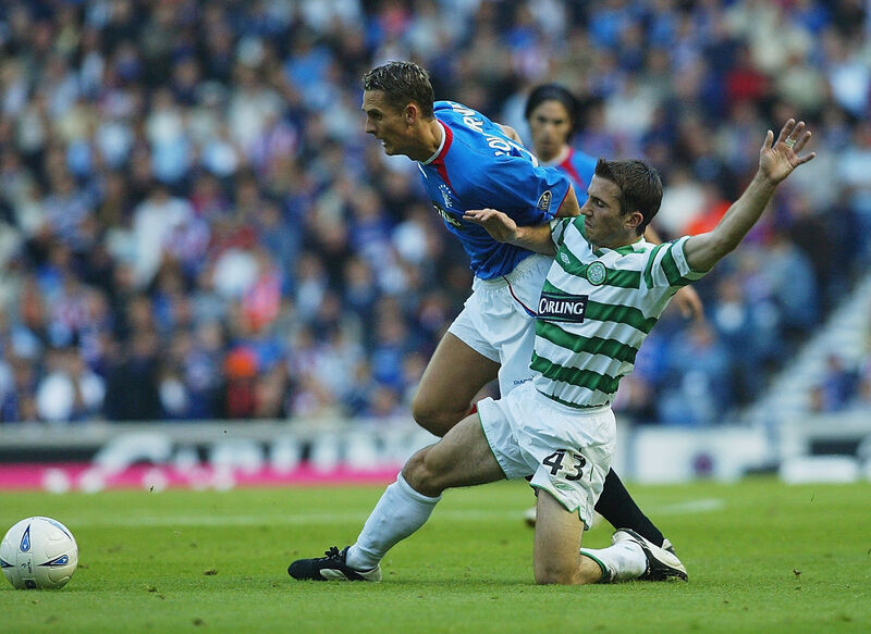 Peter Lovenkrands of Rangers gets tackled by Liam Miller in 2003. Picture: Phil Cole/Getty Images Peter Lovenkrands of Rangers gets tackled by Liam Miller in 2003. Picture: Phil Cole/Getty Images