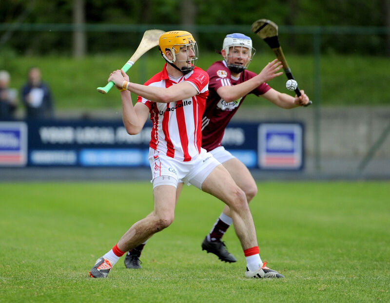 John Cronin about to strike the sliotar away from Bishopstown's Alan O'Sullivan. Picture: Gavin Browne