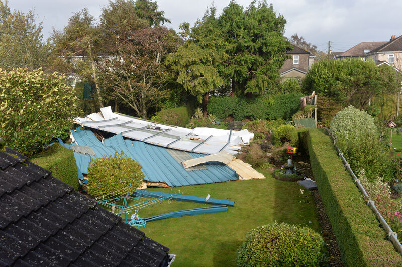 A section of the roof off the Douglas Community School gym which was blown into the garden of Mona Lynch in the height of the hurricane Ophelia. Picture Dan Linehan