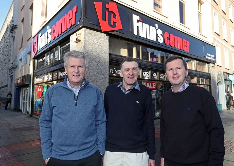 Moss Finn, John O'Dwyer, long-serving staff member, and Will Finn. Picture: Jim Coughlan Moss Finn, John O'Dwyer, long-serving staff member, and Will Finn. Picture: Jim Coughlan