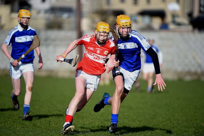 Liam O'Shea, Midleton CBS and Craig Hanafin, North Mon AG chase possession. Picture: Larry Cummins