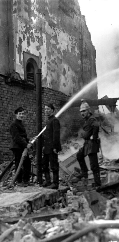 TRAIL OF DEVASTATION: Firefighters train their hose on smouldering buildings in the devastating aftermath of the Burning of Cork on December 12, 1920