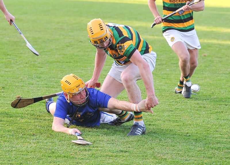 St Finbarr’s Ian Lordan gets his pass away under pressure from Glen Rovers’ Dave Noonan. Picture: David Keane.