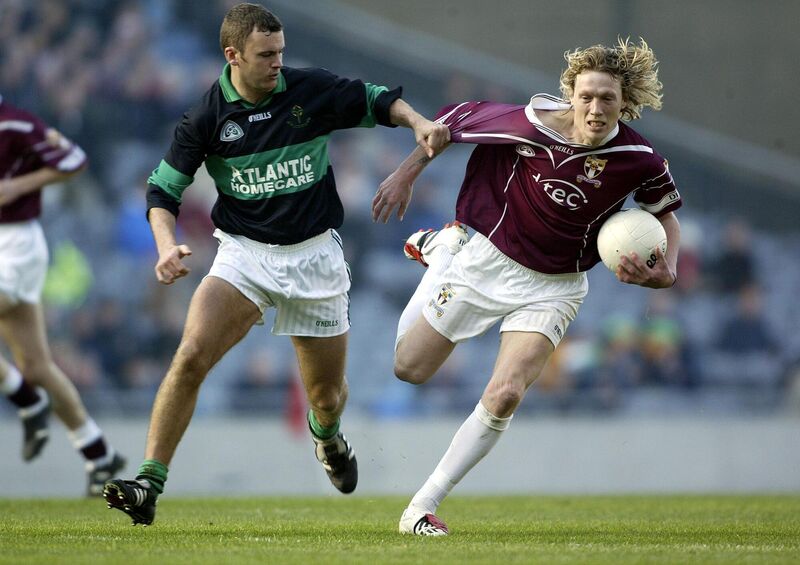 Alan Cronin and Colm O’Reilly, Crossmolina, tussle for the ball during the final. 	 Picture: Maurice O’Mahony