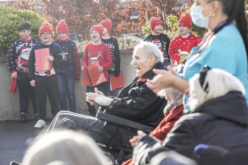 Noah Sheehan with fellow 5th class pupils from Scoil Íosagáin spreading Christmas cheer singing to residents of Heather House, Heather House, Saint Mary's Health Campus in Farranree, as part of Music Generation Cork City's 'Glow on the Go', a part of Re-Imagine Glow, in communities around the city this week! Noah Sheehan with fellow 5th class pupils from Scoil Íosagáin spreading Christmas cheer singing to residents of Heather House, Heather House, Saint Mary's Health Campus in Farranree, as part of Music Generation Cork City's 'Glow on the Go', a part of Re-Imagine Glow, in communities around the city this week!