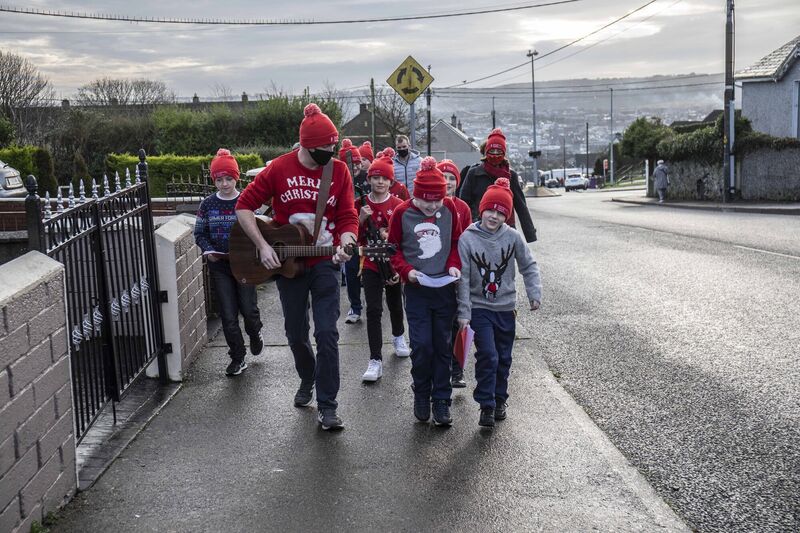 Múinteoir Brian Hennessey with his 5th class student CJ Browne and Dylan Sweeney of Scoil Íosagáin spreading Christmas cheer in Farranree early this morning as part of Music Generation Cork City's 'Glow on the Go', a part of Re-Imagine Glow, in communities around the city this week! Múinteoir Brian Hennessey with his 5th class student CJ Browne and Dylan Sweeney of Scoil Íosagáin spreading Christmas cheer in Farranree early this morning as part of Music Generation Cork City's 'Glow on the Go', a part of Re-Imagine Glow, in communities around the city this week!