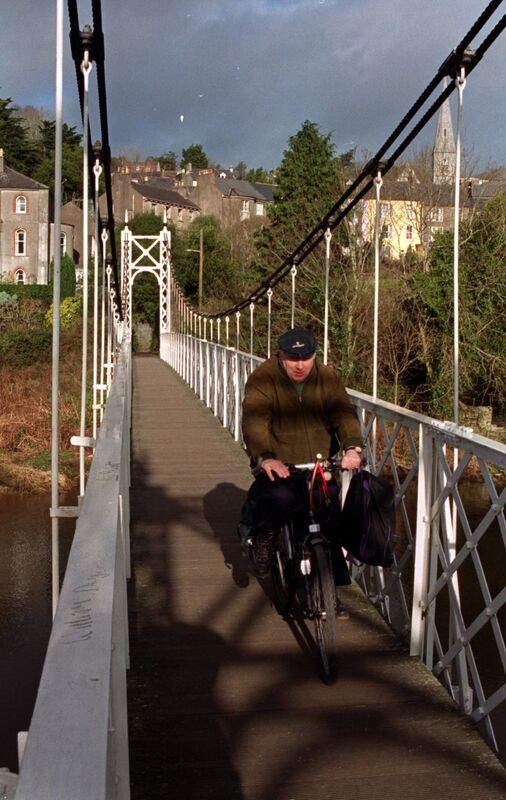 Man cycling over the Shakey Bridge in 2000. Man cycling over the Shakey Bridge in 2000.
