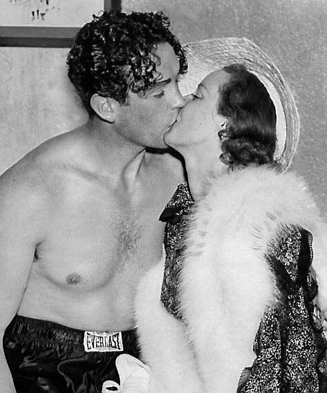 Jack Doyle gets a kiss from his wife, actress Judith Allen, after he knocked out Phil Donato at the Dyckman Oval. Picture: Charles Hoff/NY Daily News Archive via Getty Images
                    