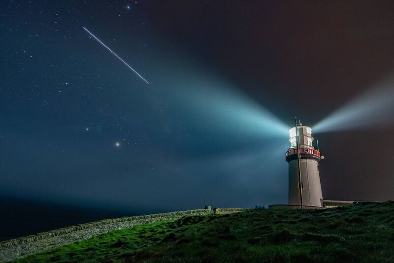The International Space Station flies high above Galley Head Lighthouse in West Cork, with the bright planets Jupiter and Saturn visible below. Picture: Cian O'Regan.  The International Space Station flies high above Galley Head Lighthouse in West Cork, with the bright planets Jupiter and Saturn visible below. Picture: Cian O'Regan.