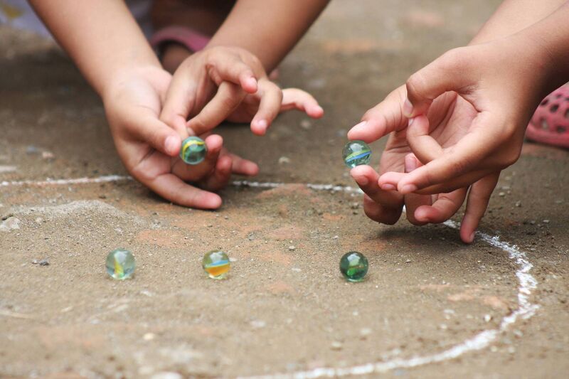 playing marbles stock shot