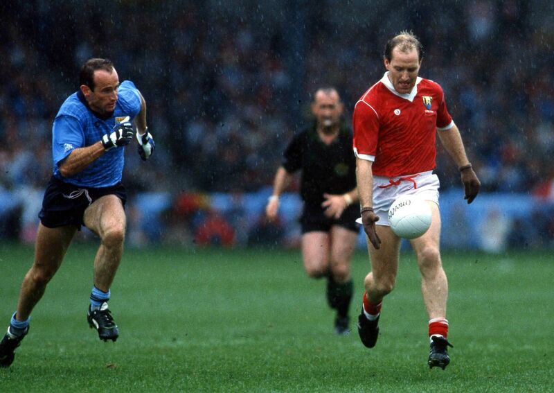 Dublin's Tommy Carr tracks Dave Barry of Cork in the 1989 All-Ireland football semi-final at Croke Park. Picture: INPHO