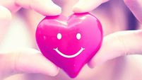 Woman hands hold Smile red heart. Valentine day love, Healthcare and medicine concept.