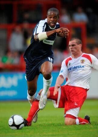 Former Stevenage defender Darren Murphy tackles Southend United's Francis Laurent.