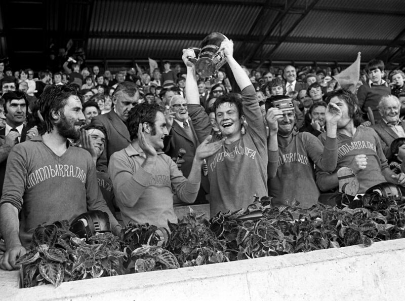 Barrs captain Denis Burns holds the cup aloft.