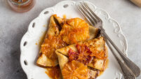 crepes suzette, delicious pancakes with orange sauce, square image