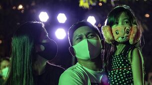 <p class="contextmenu internal_Caption">Masked Filipinos celebrate the dawn of 2021 in Manila. Should that country’s health workers get a vaccine ahead of healthy Irish?</p>