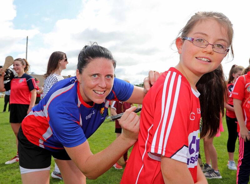 Gemma O'Connor, Cork Senior Camogie team signing a shirt for Ciara O'Driscoll, Enniskeane