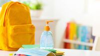 Backpack of school child. Face mask and sanitizer.