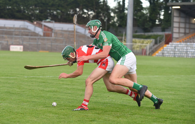  Mark McCarthy, Aghada, fouls DJ Twomey, Courcey Rovers, in last year's Co-Op Superstores Cork PIHC at Páirc Uí Rinn. Picture: Larry Cummins
