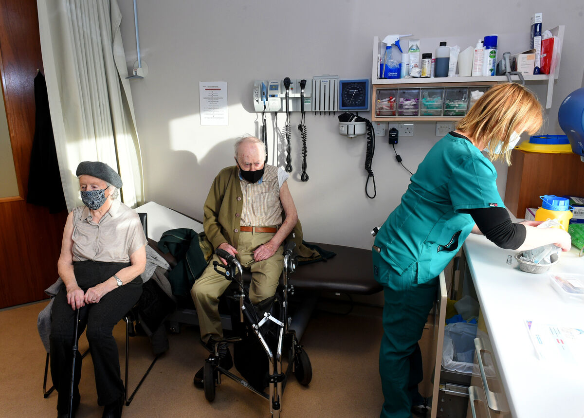  (right) Dr Nuala O'Connor gave the Covid-19 vaccine to 96 year-old Cathy Daly and her husband 94 year-old Tim Daly, pictured here in an examination room.
