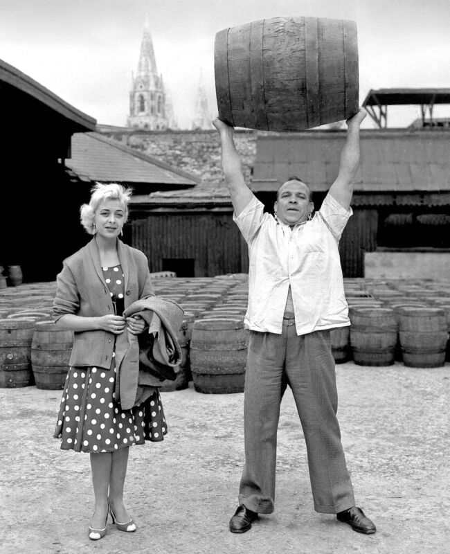 Kerry strongman Butty Sugrue lifts a full barrel of porter on a visit by Duffy’s Circus to the Beamish &amp; Crawford brewery in 1959.
