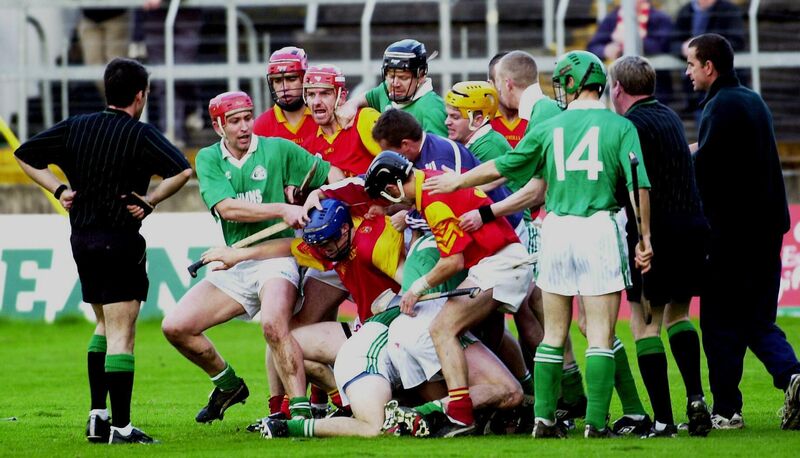 Diarmuid Kirwan looks on as Killeagh and Mallow players pile in. Picture: Des Barry