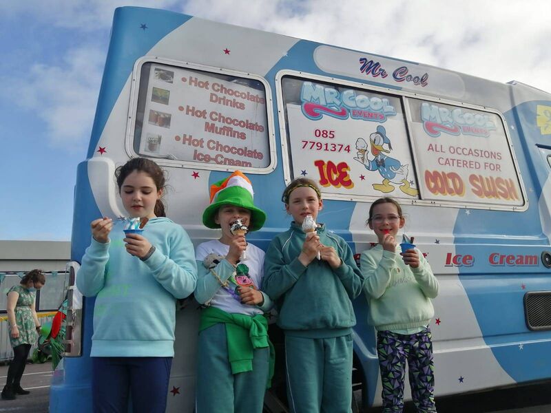 The festivities included a colourful, creative parade,"cluichí agus rince Gaelach" and the surprise arrival of Mr Cool's ice-cream van.