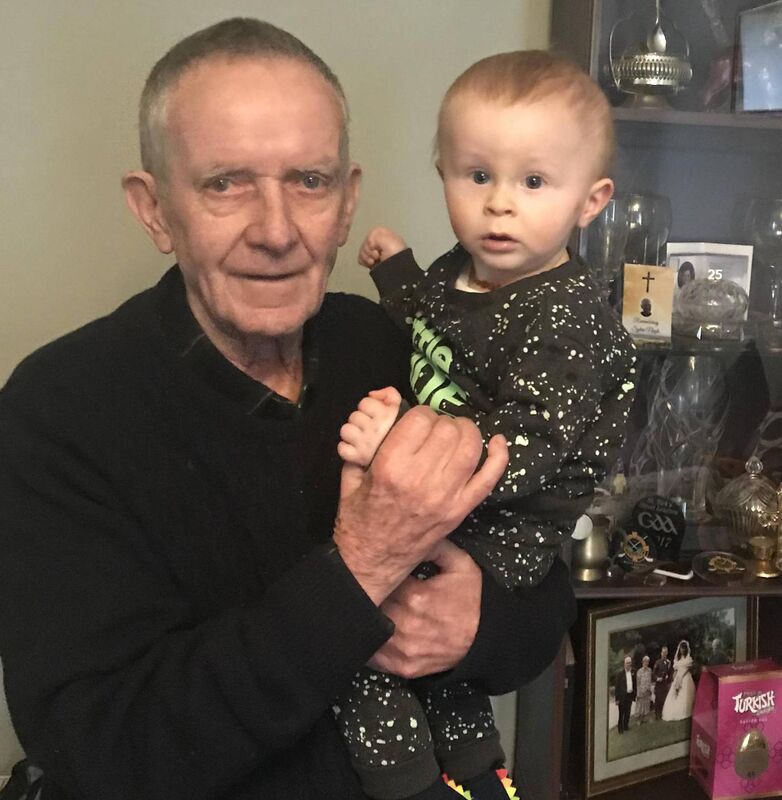 Coach John O’Leary with his great-grandson Charlie at their home recently.