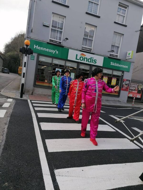 Four local characters marked the new pedestrian crossing in Bridge Street, Skibbereen with a humorous reenactment of the famous Beatles album cover Abbey Road.