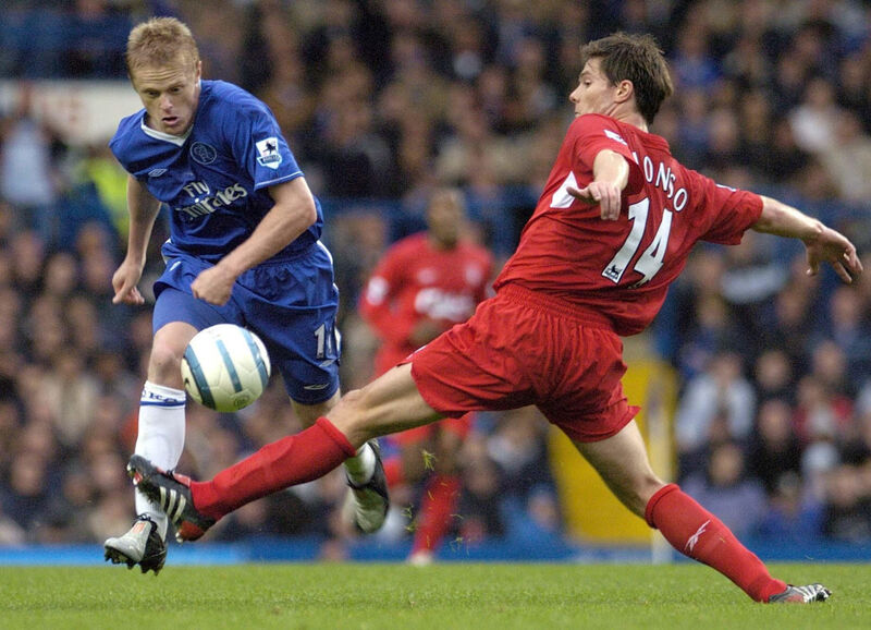 Chelsea's Damien Duff and Liverpool's Xabi Alonso in action. Picture: Rebecca Naden/PA.