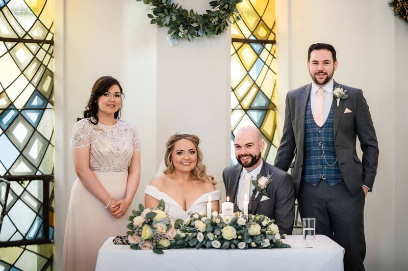 The couple signing the registrar.