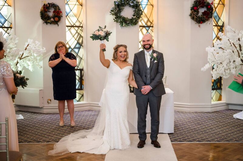 Mr and Mrs celebrating after tying the knot.
