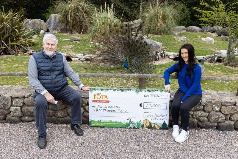 Chelsea Sheehan with Park Director Sean McKeown, and a cheque for €10,000. Pic: Fota Wildlife Park.