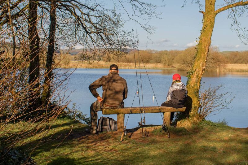 A man and his son fishing at The Gearagh.