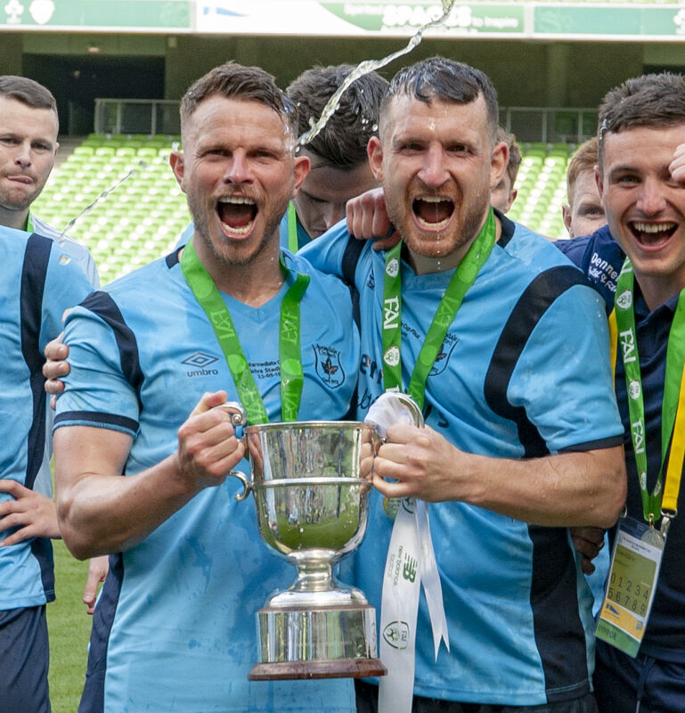 Avondale's Eoghan Lougheed and Hughie O'Donovan are sprayed with champagne after their Intermediate Cup win. Picture: Brian Lougheed