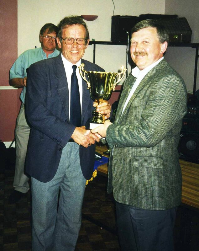 Former Cork Hibernians and Cork Celtic goalkeeper Peter Gregson, then with CIE Athletic, receives a presentation from CBSL registrar Jackie O'Driscoll in 1990. Picture: Finbarr Buckley