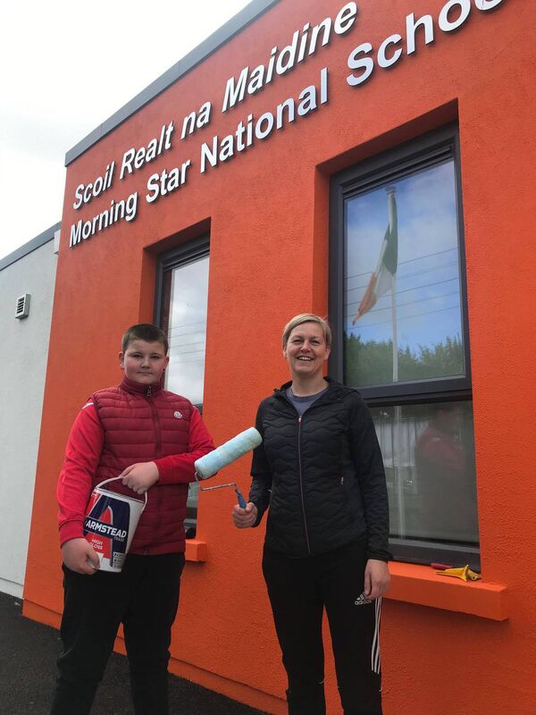 Aine O'Loughlin from The Harp Bar that helped with paint sponsorship, giving a hand with son Conor Aine O'Loughlin from The Harp Bar that helped with paint sponsorship, giving a hand with son Conor