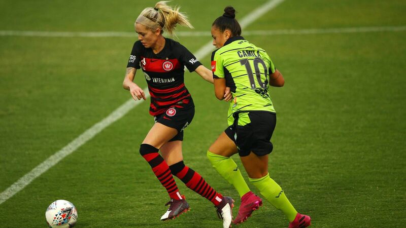 Is it better for Cork soccer players to develop at home or in the USA?