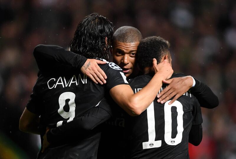 Edinson Cavani of PSG celebrates scoring his sides third goal with Neymar and Kylian Mbappe. Picture: Mike Hewitt/Getty Images