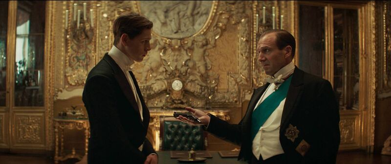 The King's Man. Pictured: (L-R) Harris Dickinson as Conrad and Ralph Fiennes as Oxford. PA Feature SHOWBIZ Film Blockbusters. Picture: Picture: PA Photo/© 2020 Twentieth Century Fox Film Corporation. The King's Man. Pictured: (L-R) Harris Dickinson as Conrad and Ralph Fiennes as Oxford. PA Feature SHOWBIZ Film Blockbusters. Picture: Picture: PA Photo/© 2020 Twentieth Century Fox Film Corporation.