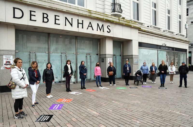 Some of the ex-Debenhams workers outside the former Debenhams store on Patrick St., Cork, at the end of their 406-day struggle for justice. Picture Denis Minihane. Some of the ex-Debenhams workers outside the former Debenhams store on Patrick St., Cork, at the end of their 406-day struggle for justice. Picture Denis Minihane.