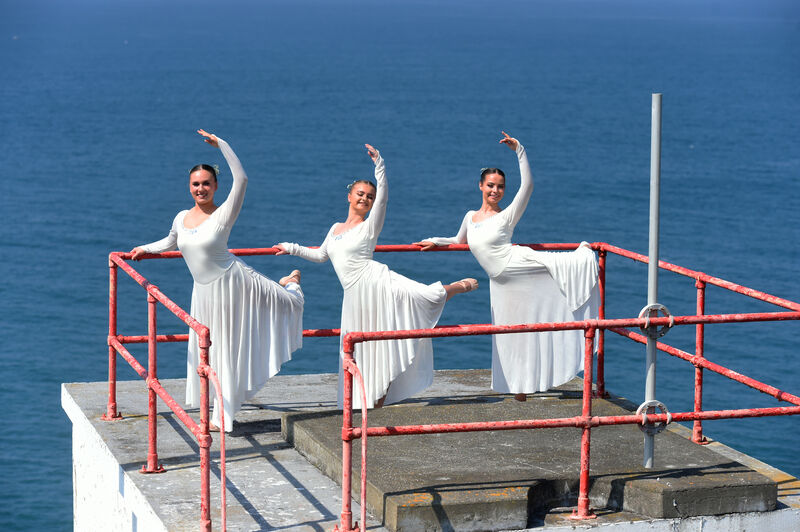 Fifty six dance students of Joan Denise Moriarty School of Dance are recording a dance video ahead of Cruinniú na nÓg next month. Some of the senior girls danced at the lighthouse on the Old Head of Kinsale, Co Cork on the Wild Atlantic Way on Sunday. Pictured are Ella Sladewski, Chelsea O'Callaghan and Maedhbh Hayes dancing beneath the lighthouse. Picture: Larry Cummins. Fifty six dance students of Joan Denise Moriarty School of Dance are recording a dance video ahead of Cruinniú na nÓg next month. Some of the senior girls danced at the lighthouse on the Old Head of Kinsale, Co Cork on the Wild Atlantic Way on Sunday. Pictured are Ella Sladewski, Chelsea O'Callaghan and Maedhbh Hayes dancing beneath the lighthouse. Picture: Larry Cummins.