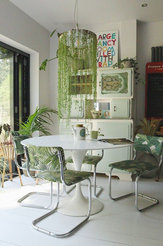 Emilie Fournet Interiors' green kitchen with vintage furniture. Picture: PA Photo/Emily Ayres. 