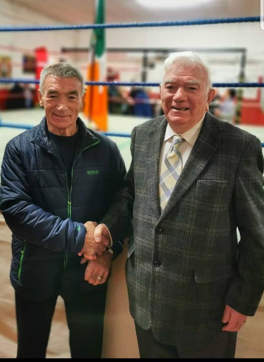Glen boxing club coach Tom Kelleher congratulates former Glen stalwart John Martin who was honoured by the club recently for the outstanding service he has given through the years. Glen boxing club coach Tom Kelleher congratulates former Glen stalwart John Martin who was honoured by the club recently for the outstanding service he has given through the years.