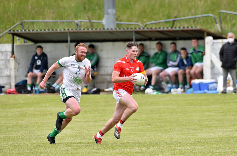 Ciaran O'Sullivan, Urhan, breaking past Passage player James Kind. Picture: Dan Linehan Ciaran O'Sullivan, Urhan, breaking past Passage player James Kind. Picture: Dan Linehan