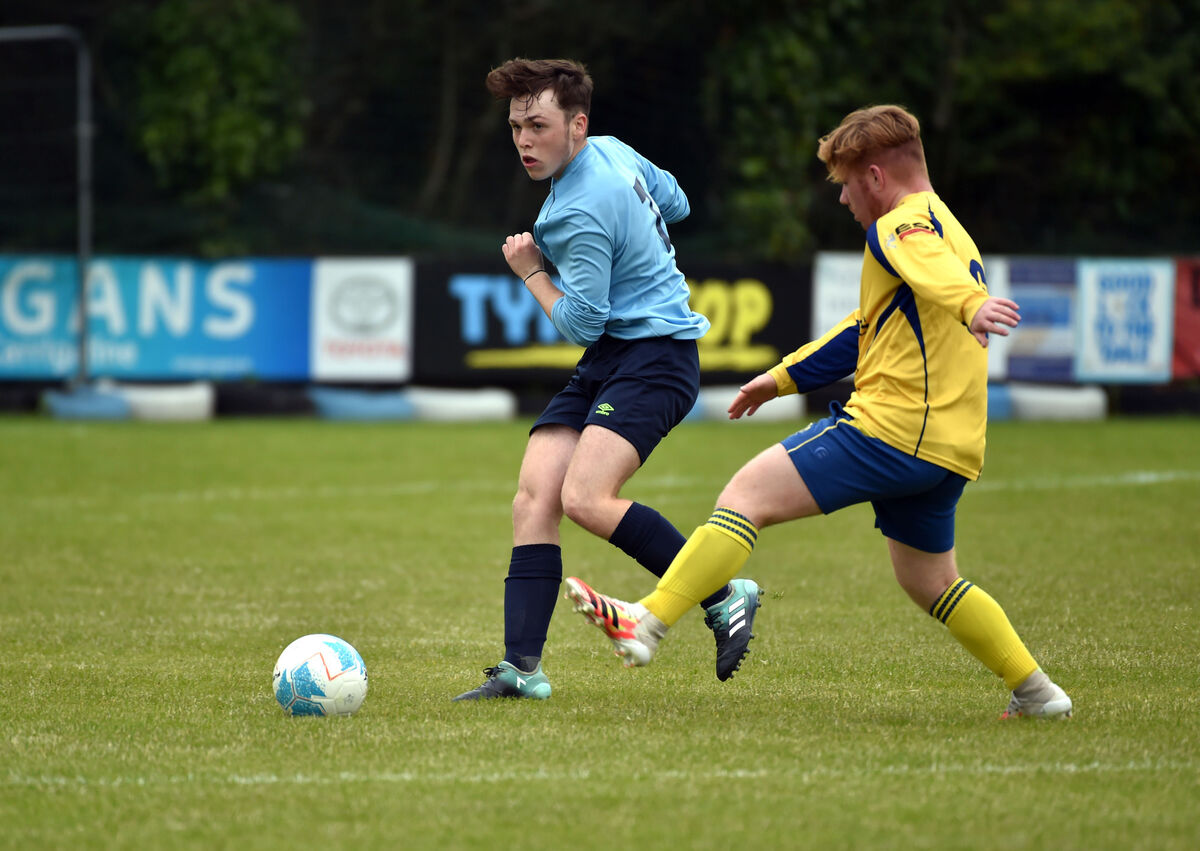 Avondale United's Stephen St Ledger knocks the ball past Douglas Hall's Matthew Murphy. Picture: Eddie O'Hare
