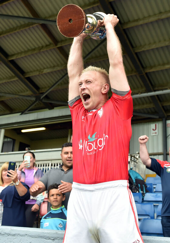 Lough Rovers captain Shane Long raises the trophy. Picture: Eddie O'Hare Lough Rovers captain Shane Long raises the trophy. Picture: Eddie O'Hare