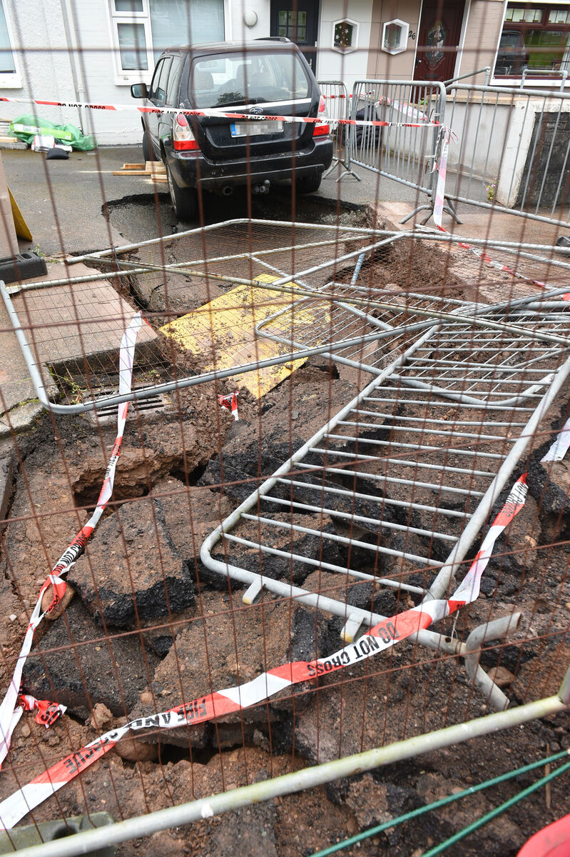 This pic shows a large area of footpath and public roadway also affected by the leak. A burst water pipe at the driveway to a home at McGrath Park, Blackrock, Cork. A sinkhole developed overnight and Cork City Fire Brigade responded to the emergency early on Sunday morning. There is considerable subsidence damage to the private-owned property with cracks visible on the exterior walls of the family home. Picture: Larry Cummins This pic shows a large area of footpath and public roadway also affected by the leak. A burst water pipe at the driveway to a home at McGrath Park, Blackrock, Cork. A sinkhole developed overnight and Cork City Fire Brigade responded to the emergency early on Sunday morning. There is considerable subsidence damage to the private-owned property with cracks visible on the exterior walls of the family home. Picture: Larry Cummins